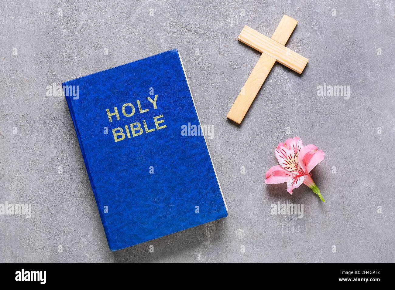 Blue Bible With Flowers Blue Holy Bible with cross and flower on grunge background Stock Photo ...