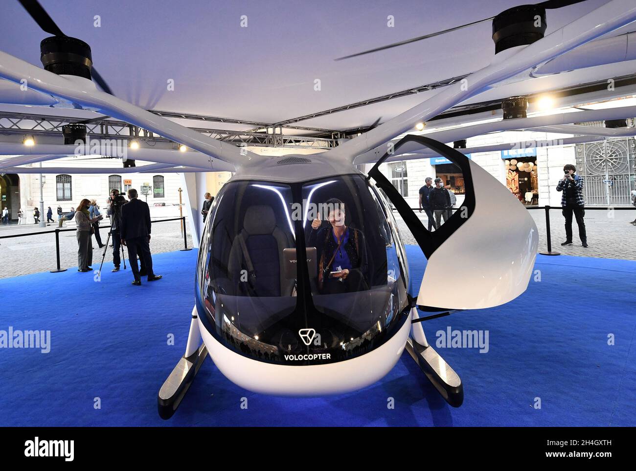 Rome, Italy on November 2, 2021. A VoloCity air taxi is exhibited in Rome, Italy on November 2, 2021. The new service will connect Rome s international airport with vertical airports across the city, reducing both traffic congestion and CO2 emissions. Rome is one of the first cities in Europe to commit to bringing urban air mobility services to its citizens with Volocopter. Paris has also committed to a collaboration to bring electric air taxis to the city in time for the 2024 Olympic Games. Urban air mobility will be part of the solution for heavily congested city centers across the world. As Stock Photo