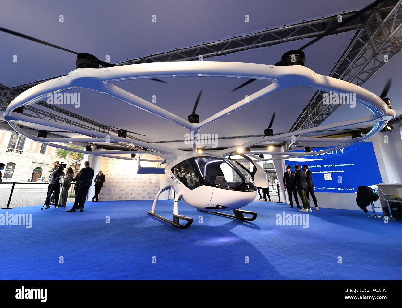 Rome, Italy on November 2, 2021. A VoloCity air taxi is exhibited in Rome, Italy on November 2, 2021. The new service will connect Rome s international airport with vertical airports across the city, reducing both traffic congestion and CO2 emissions. Rome is one of the first cities in Europe to commit to bringing urban air mobility services to its citizens with Volocopter. Paris has also committed to a collaboration to bring electric air taxis to the city in time for the 2024 Olympic Games. Urban air mobility will be part of the solution for heavily congested city centers across the world. As Stock Photo