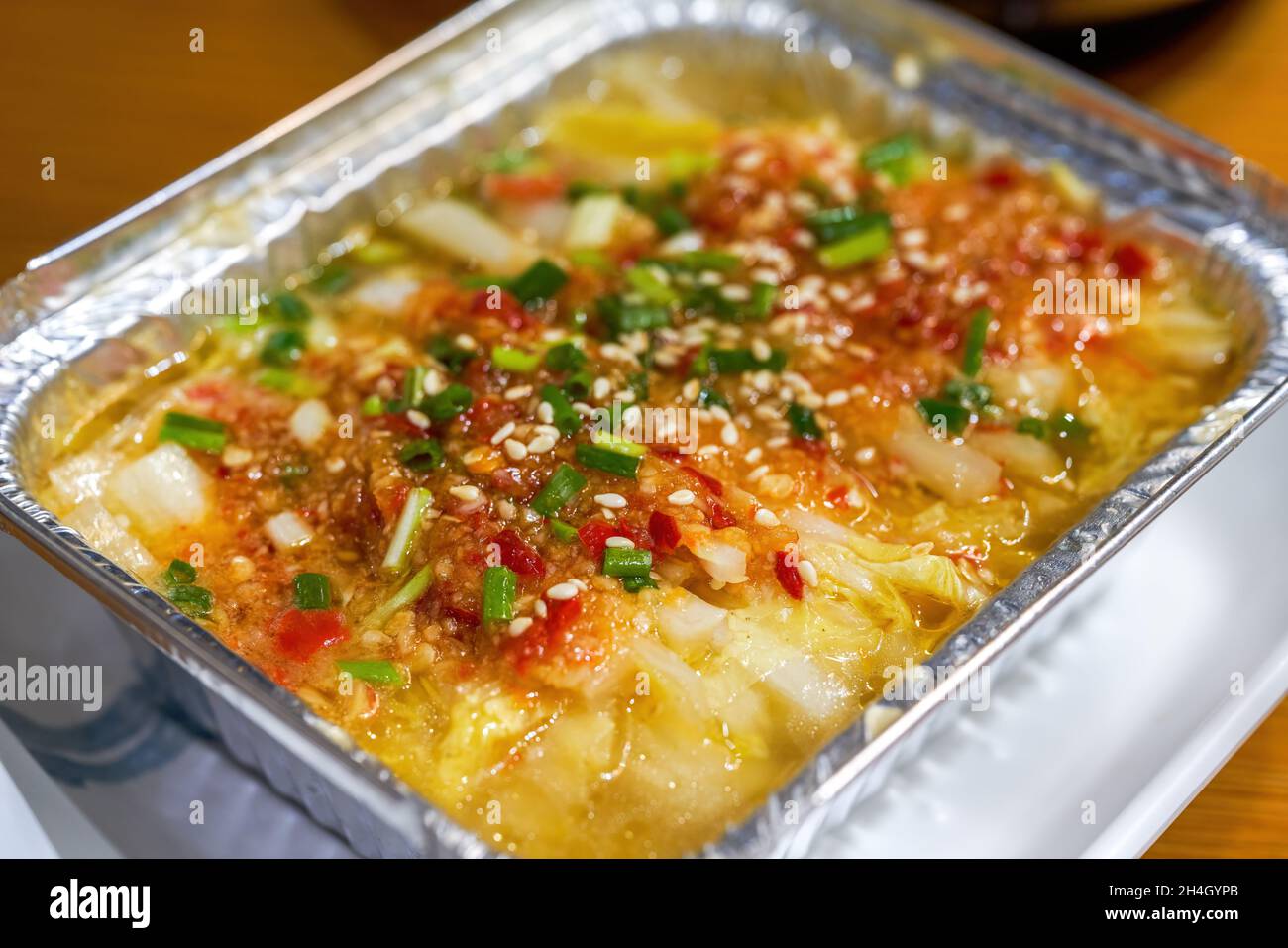 Closeup of a delicious tin foil roasted garlic cabbage Stock Photo Alamy