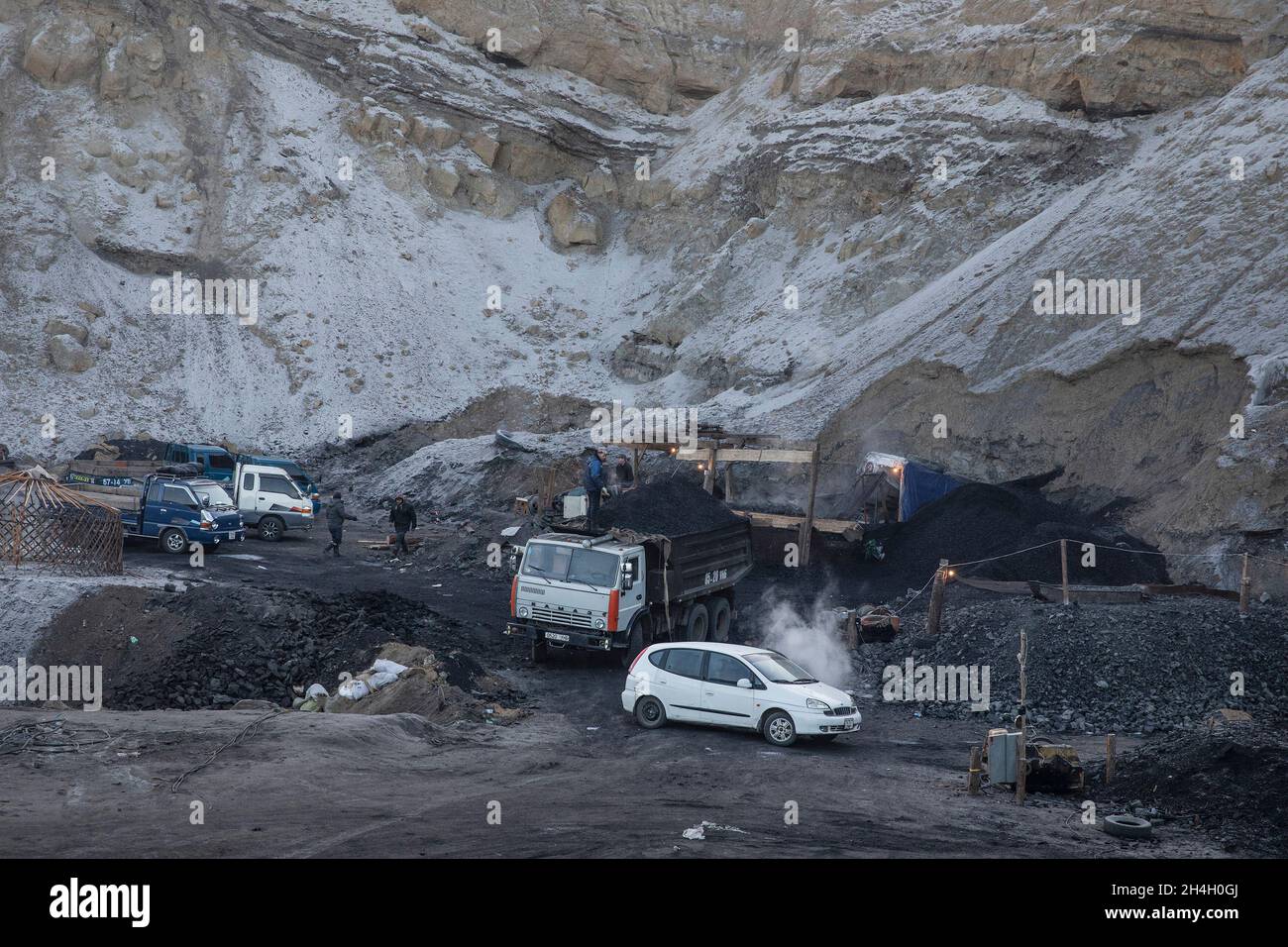 Men extract coal from an informal mine in Nalaikh, a poor urban district 36 km east of the capital Ulaanbaatar, Mongolia, January 16, 2019. The clande Stock Photo