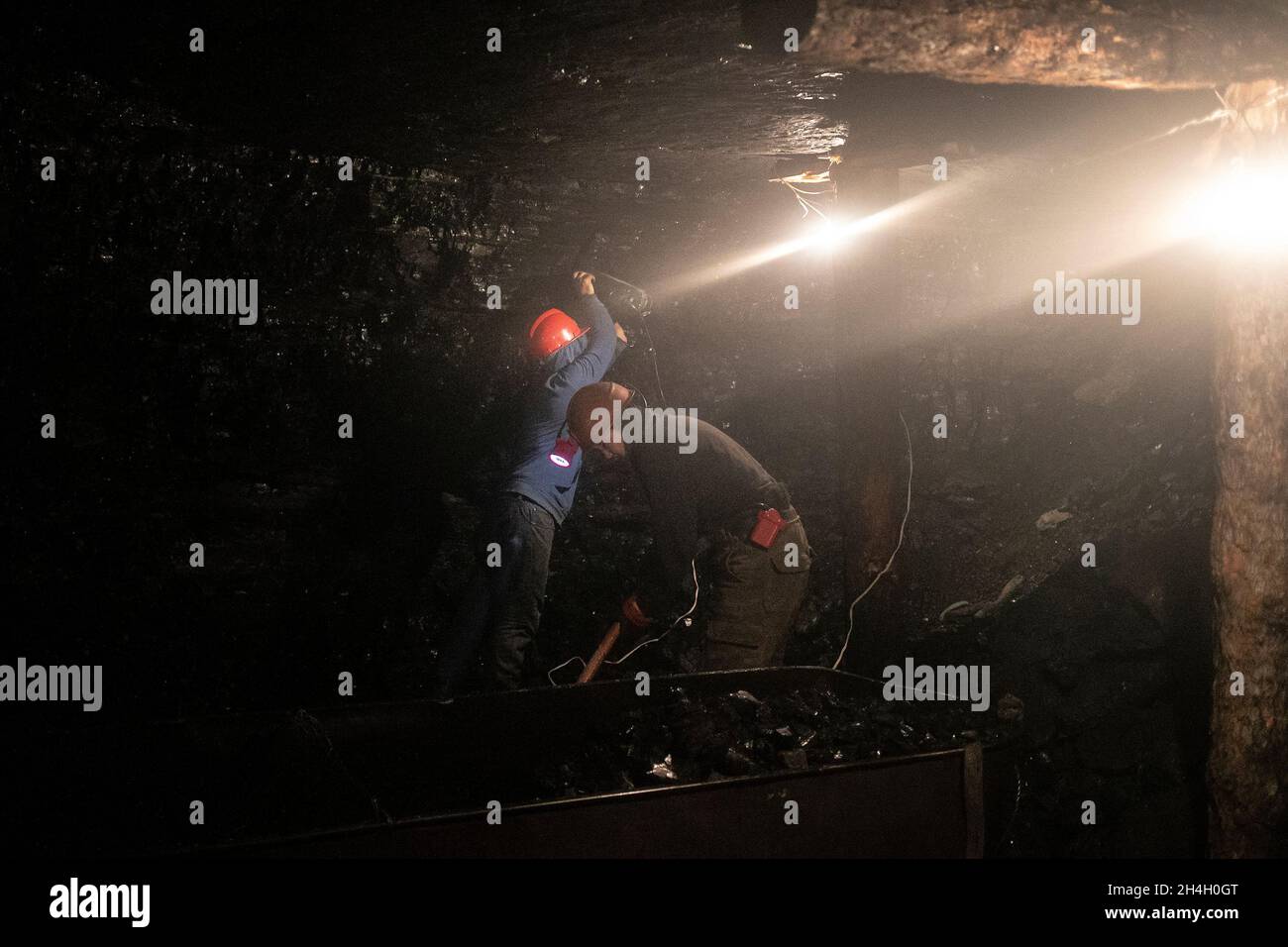 Men extract coal from an informal mine in Nalaikh, a poor urban district 36 km east of the capital Ulaanbaatar, Mongolia, January 16, 2019. The clande Stock Photo