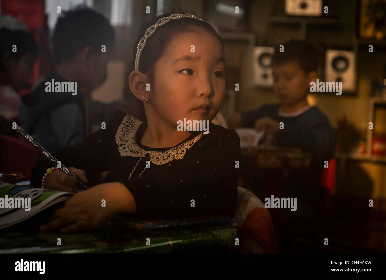A girl in a kindergarten in one of the ger district of the city, Ulaanbaatar, January 21, 2019. An ever-increasing number of children are suffering fr Stock Photo