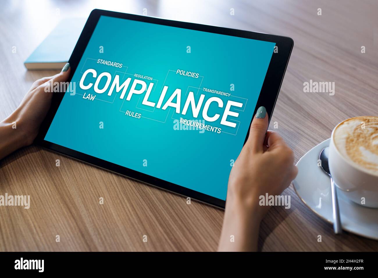 Compliance concept with icons and diagrams. Regulations, law, standards, requirements, audit. Concept on device screen. Stock Photo