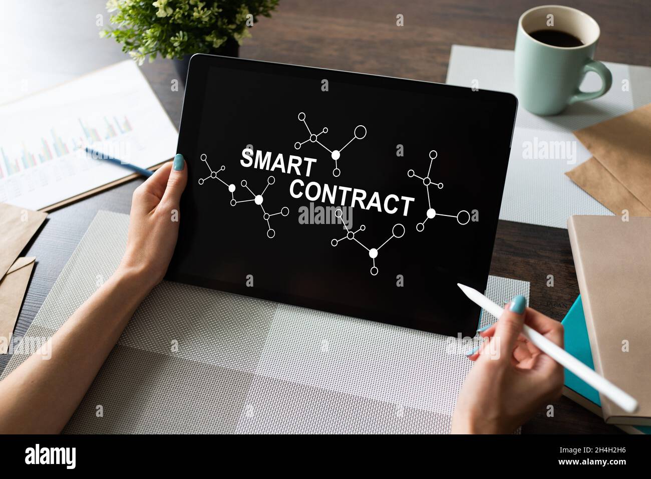 Smart contract blockchain based technology concept on screen. Cryptocurrency, Bitcoin and ethereum. Stock Photo