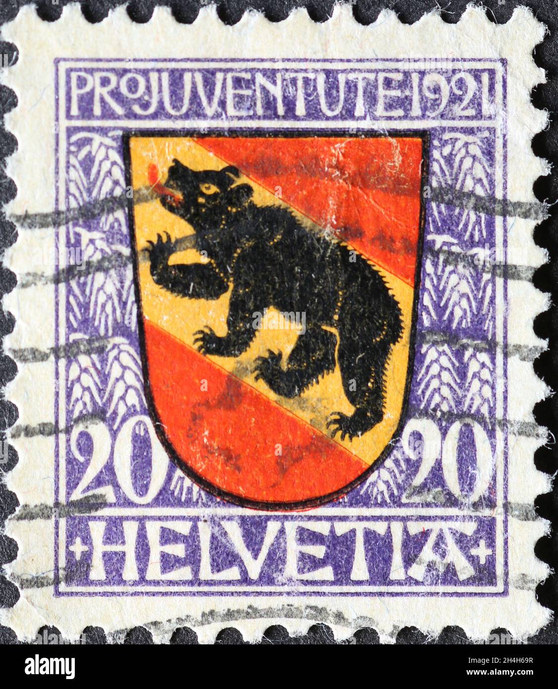 Switzerland - Circa 1921: a postage stamp printed in the Switzerland showing a red and yellow coat of arms dem bear  of the Swiss canton of Bern on a Stock Photo