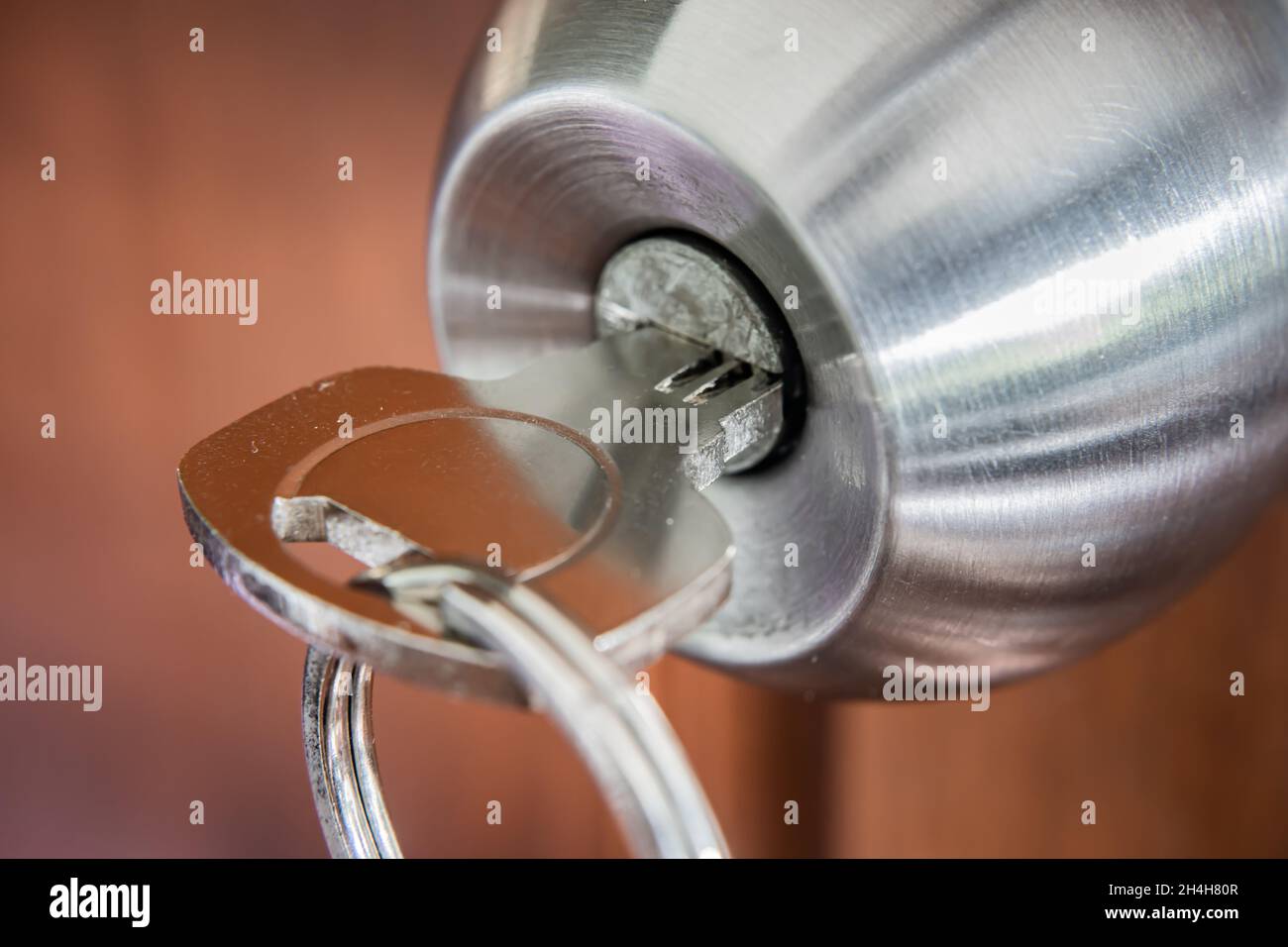 A key in a door knob Stock Photo Alamy