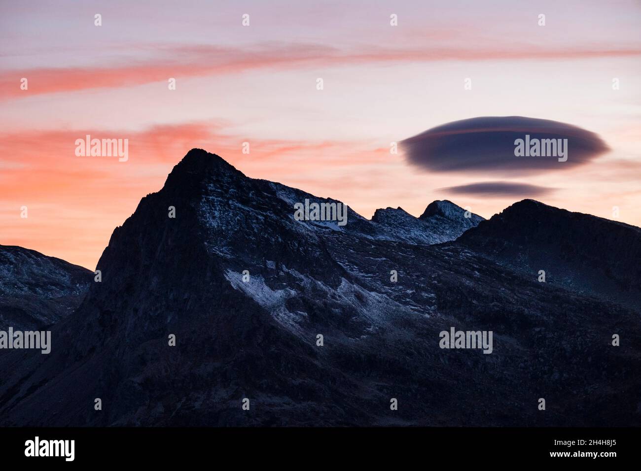 Lenticularis cloud over Lagorai range, sunset, Parco Naturale Paneveggio Pale di San Martino, Rolle Pass, Trentino, Italy Stock Photo