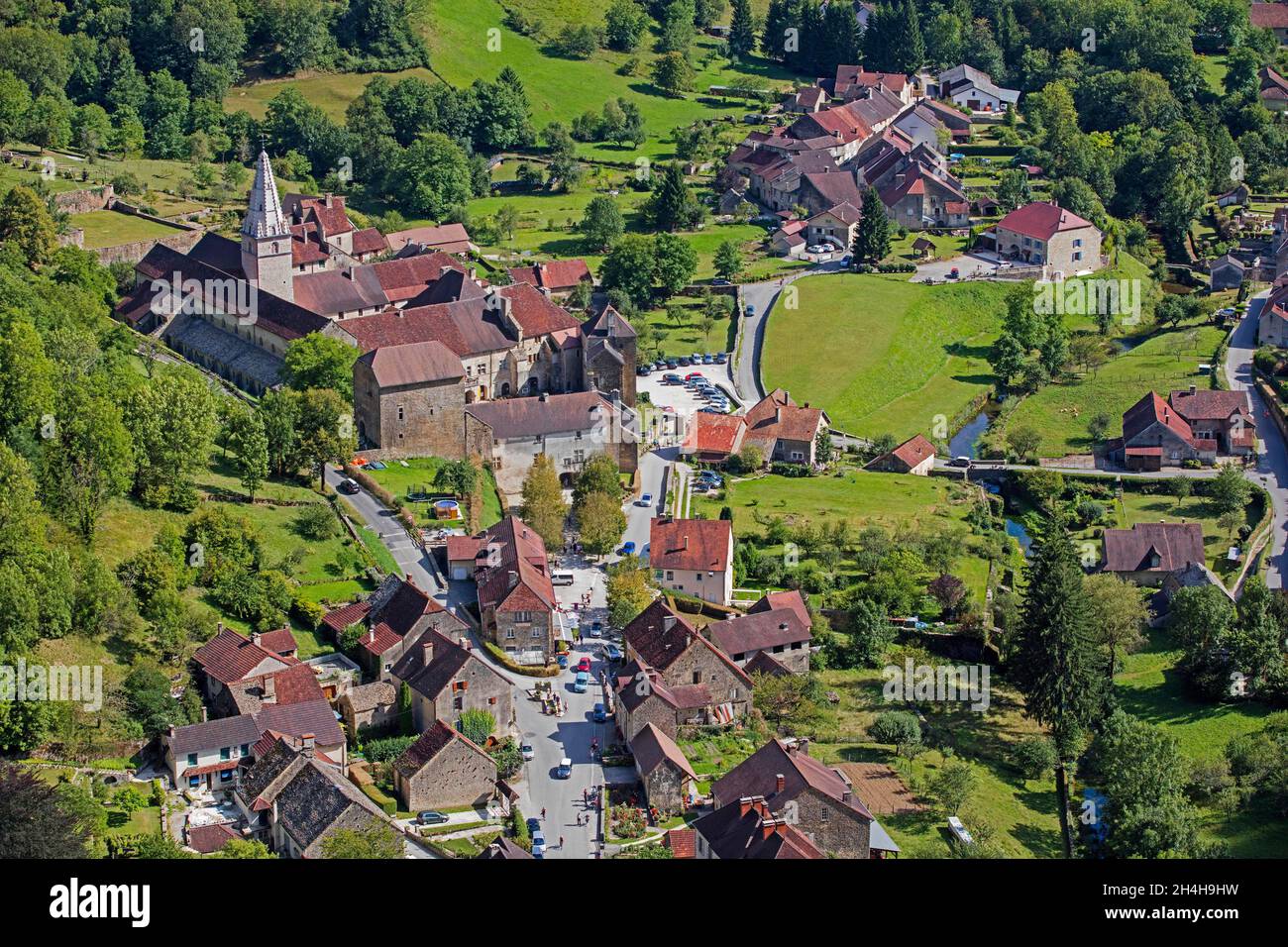 Aerial view over Baume Abbey, Abbaye Saint-Pierre de Baume-les-Messieurs and village, Jura department in Franche-Comte, Lons-le-Saunier, France Stock Photo