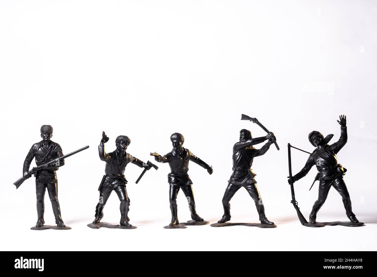 Vintage toy black soldiers isolated on white background Stock Photo - Alamy