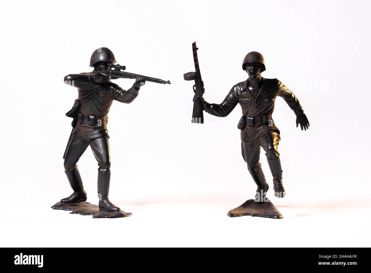 Vintage toy black soldiers isolated on white background Stock Photo - Alamy