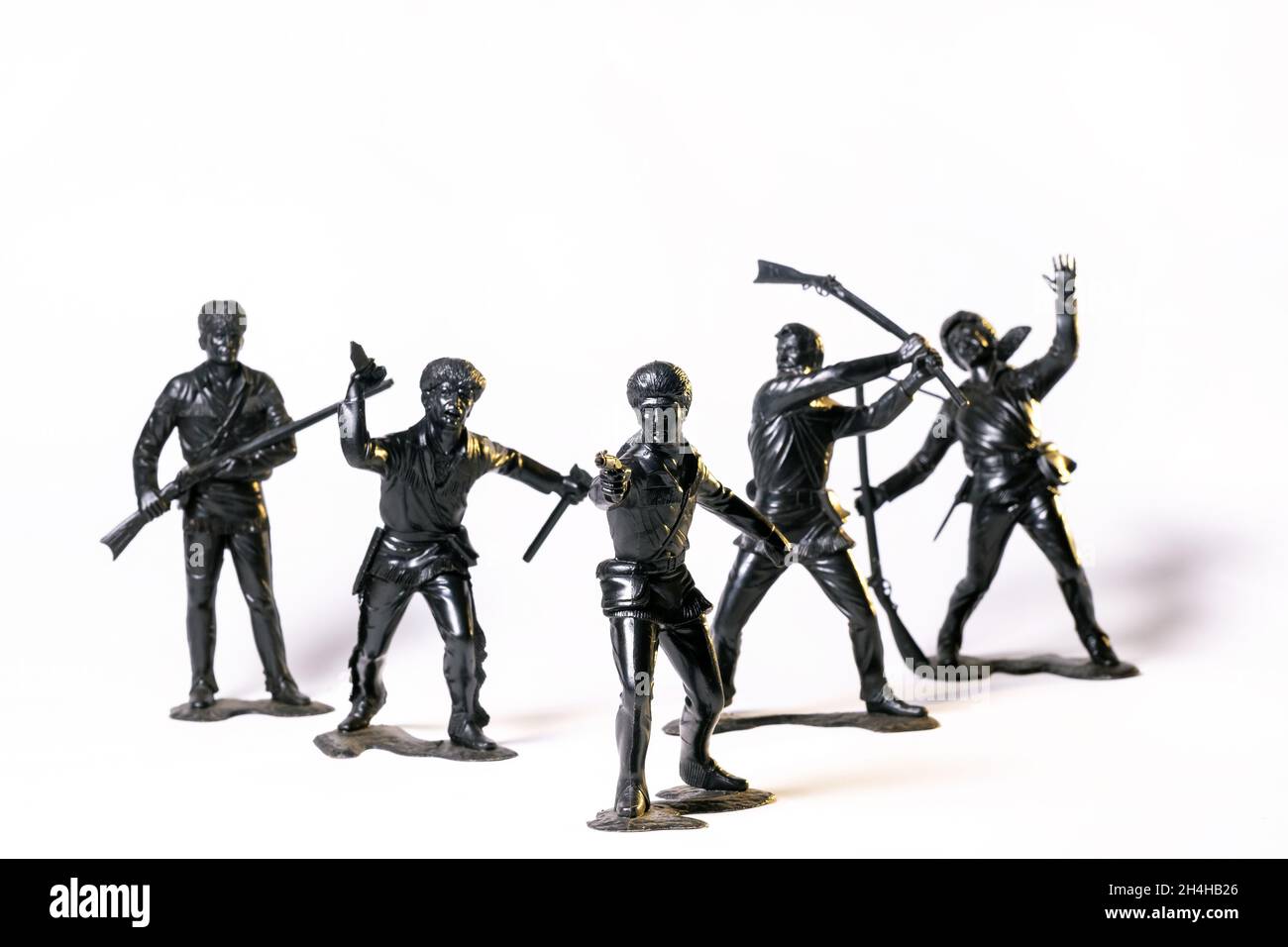 Vintage toy black soldiers isolated on white background Stock Photo - Alamy