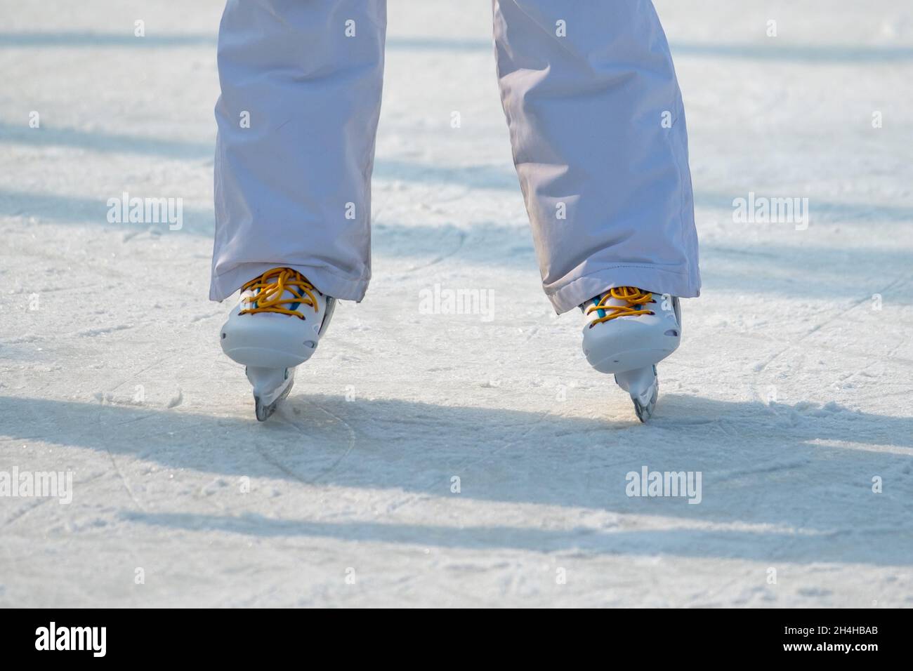 Feet in the skates on ice Stock Photo Alamy