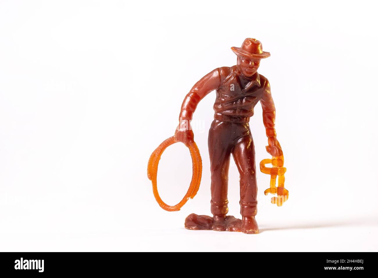 Vintage toy brown cowboy isolated on white background. Stock Photo