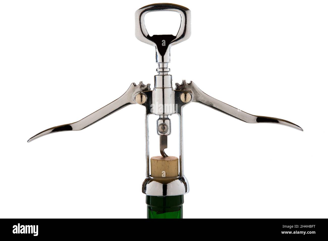 Metal corkscrew opens a wine bottle isolated on a white background ...