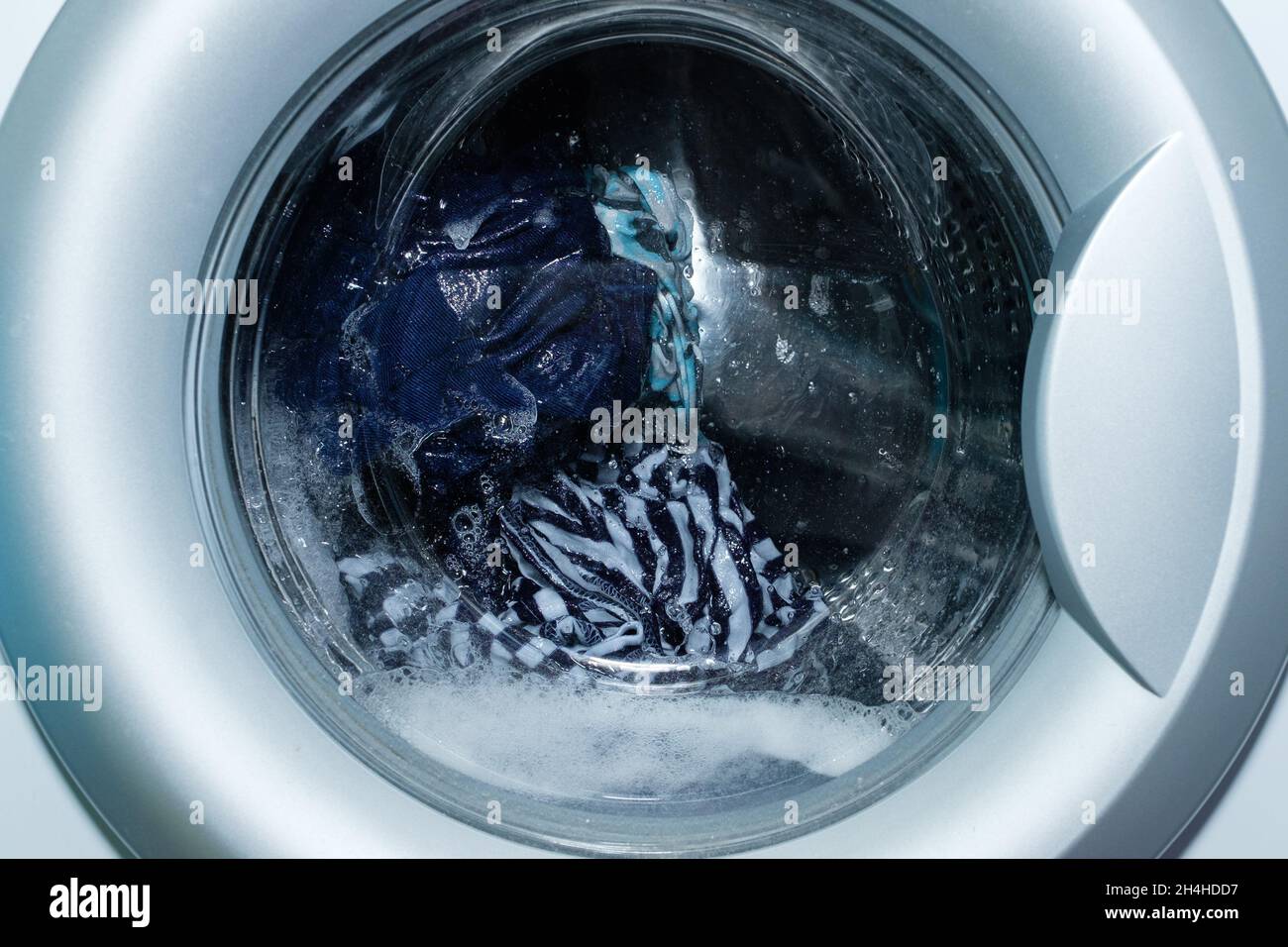 Linen washing in the washing machine. Stock Photo