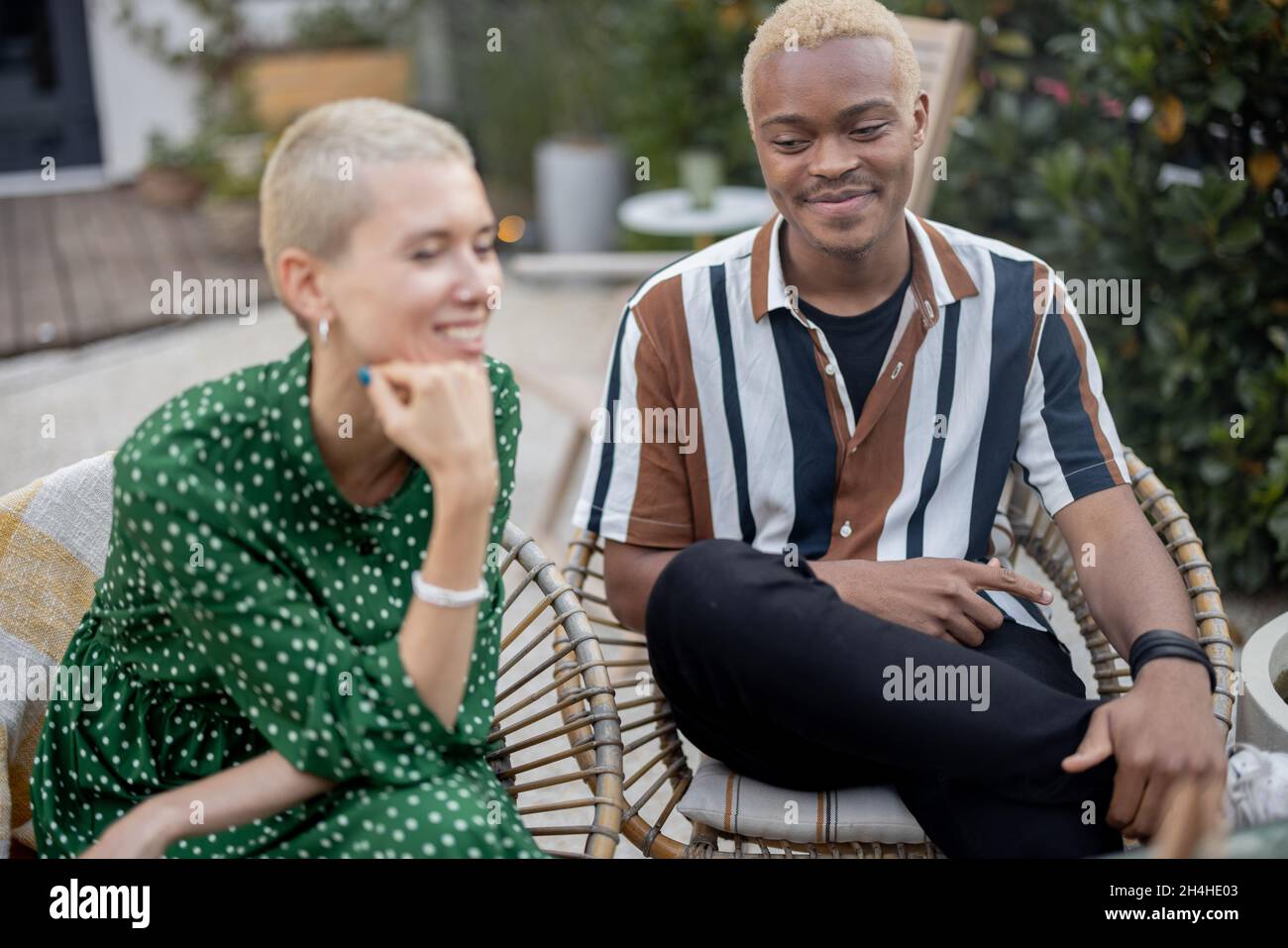 Multiracial couple having dinner at their backyard Stock Photo