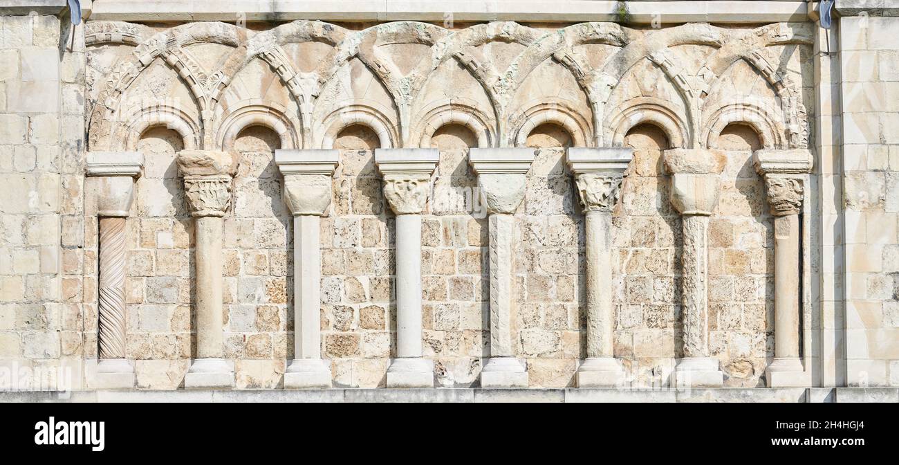 Decorative romanesque arches on an exterior wall at Canterbury cathedral, England. Stock Photo