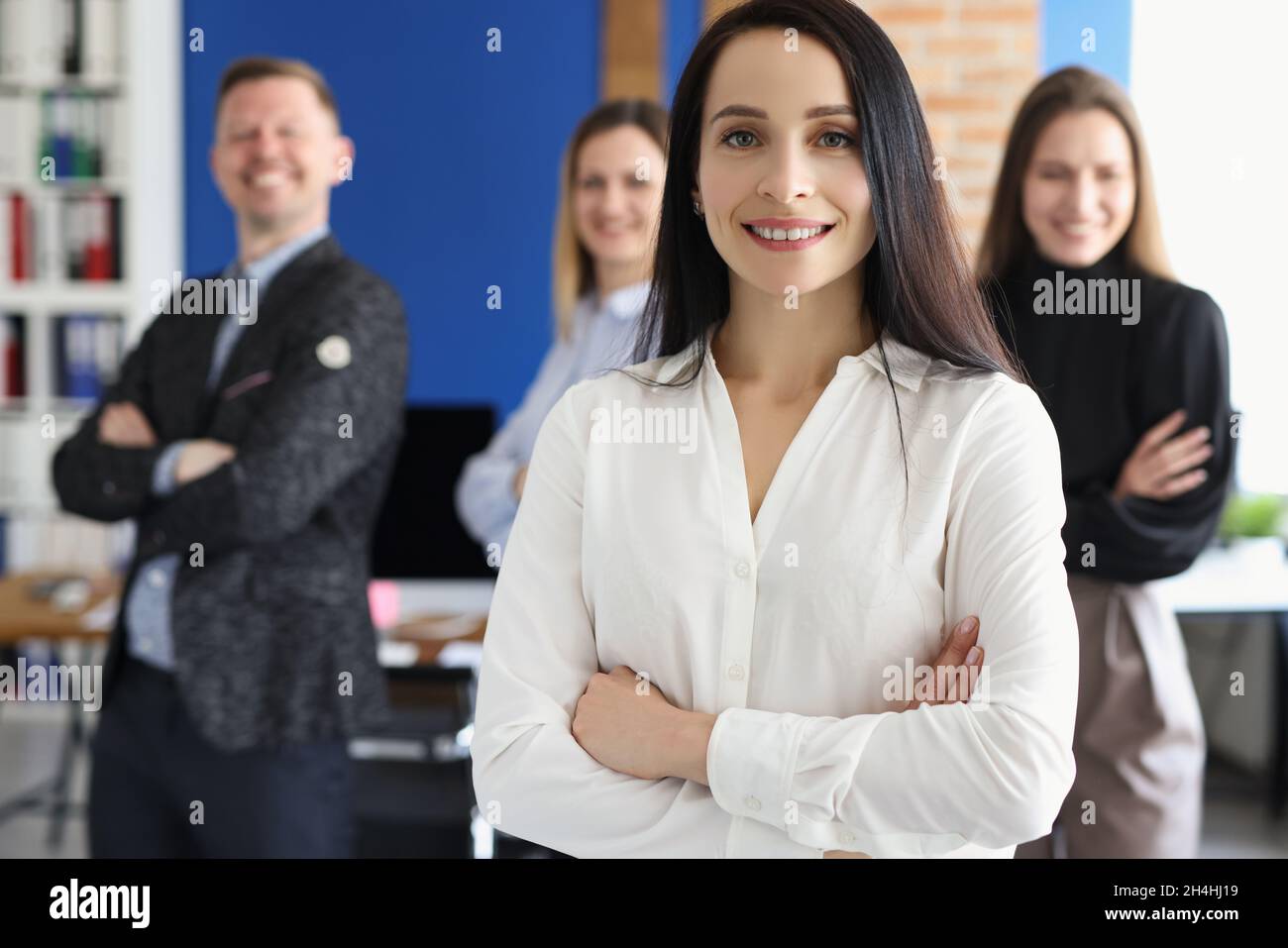 Confident people posing in company office Stock Photo