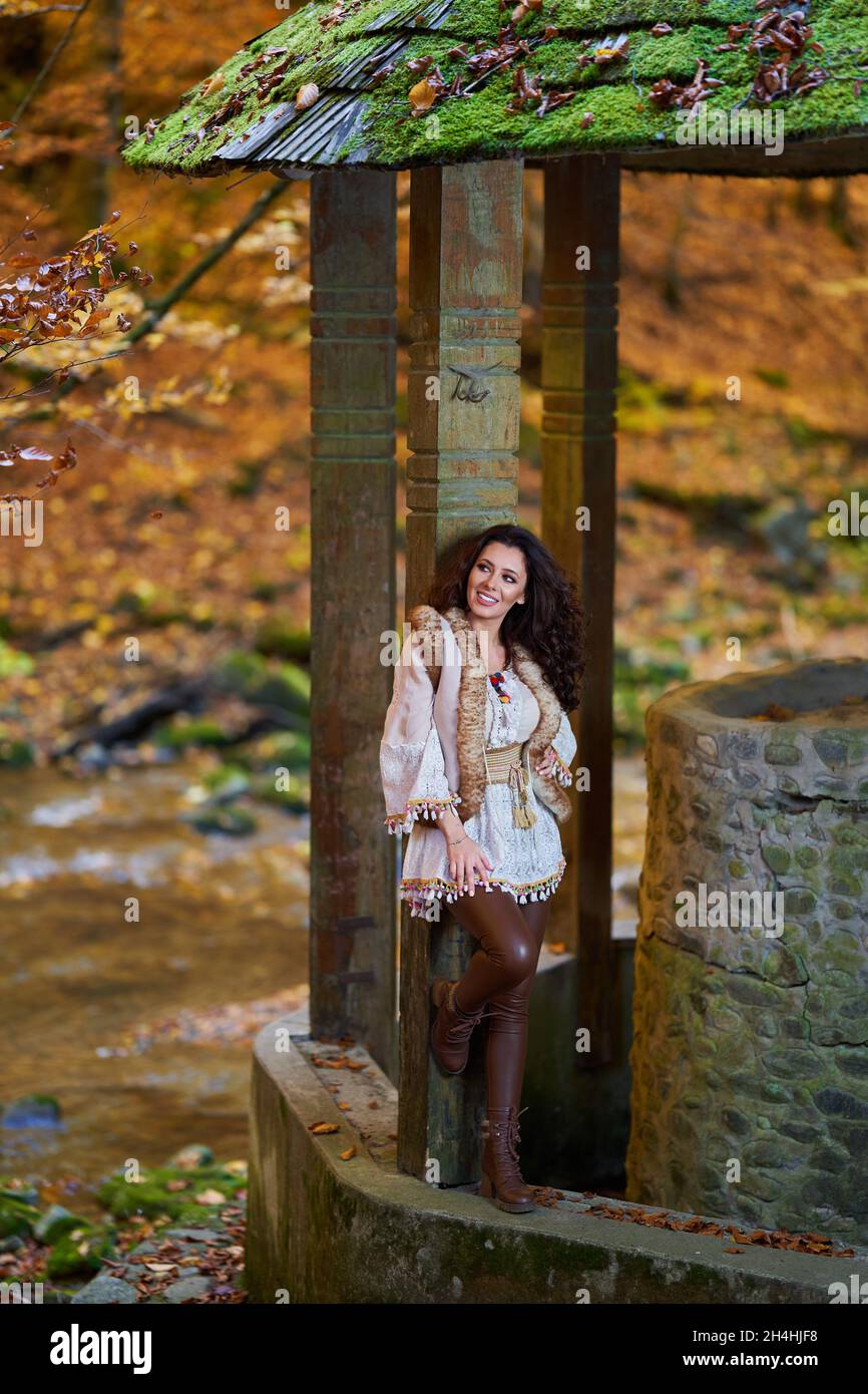 Portrait of a beautiful young woman by the river mid autumn Stock Photo ...