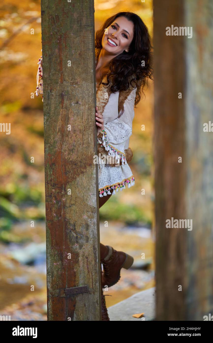 Portrait of a beautiful young woman by the river mid autumn Stock Photo ...