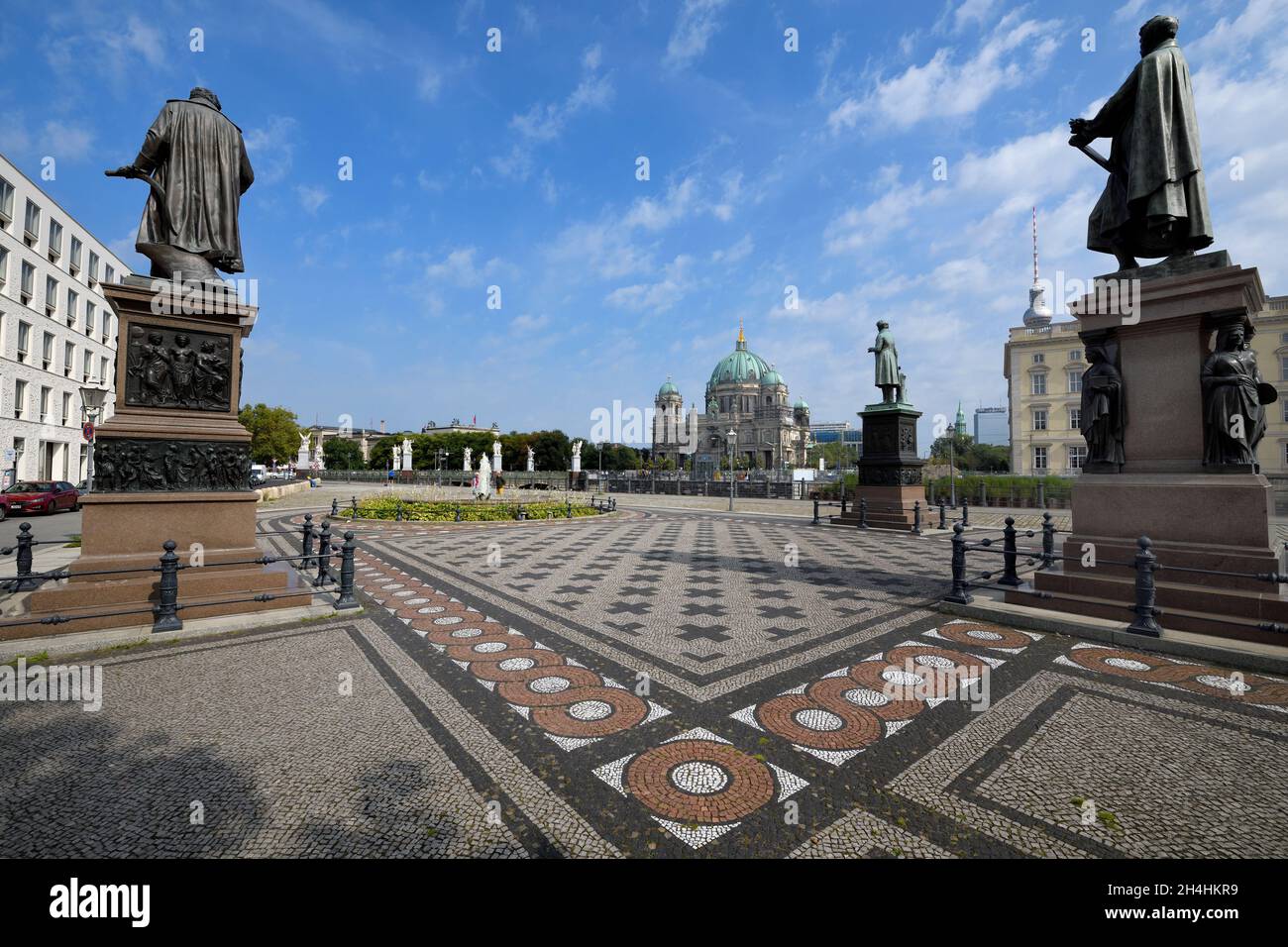 Schinkel square with statues, Schloss bridge and Berliner Dom behind, Unter den Linden, Berlin, Germany Stock Photo