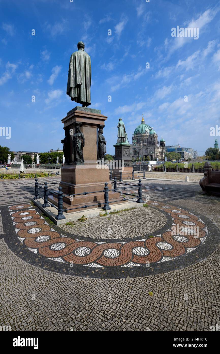 Schinkel square with statues, Schloss bridge and Berliner Dom behind, Unter den Linden, Berlin, Germany Stock Photo
