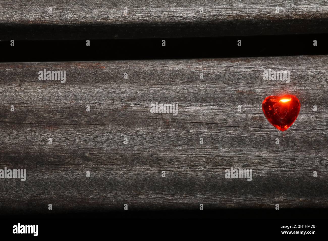 Heart on a plank of a park bench Stock Photo