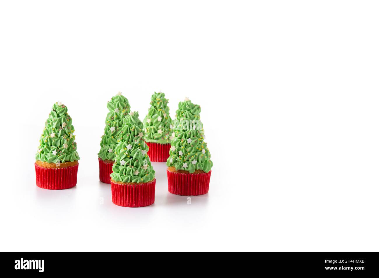 Christmas tree cupcakes isolated on white background Stock Photo