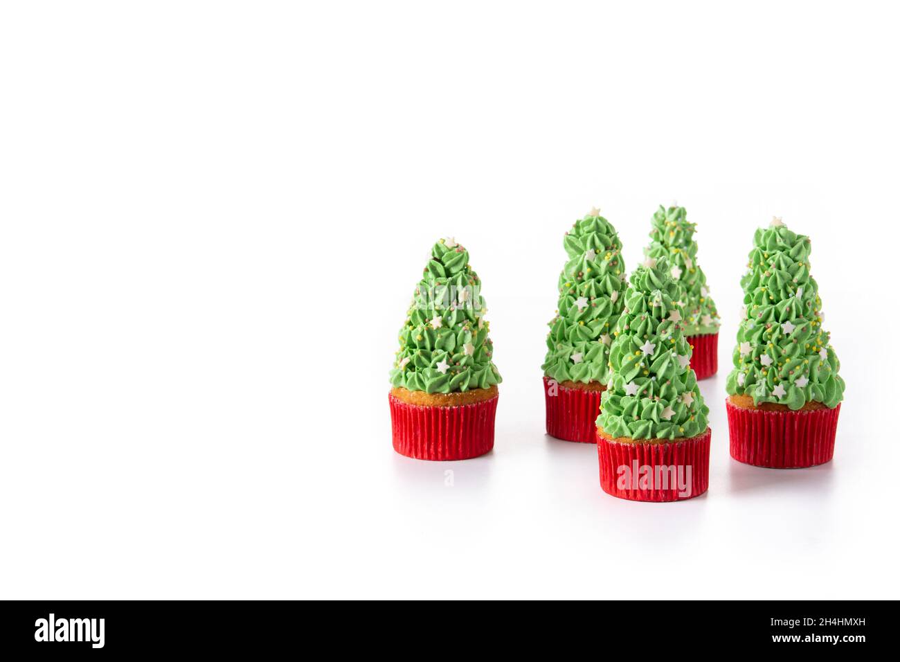 Christmas tree cupcakes isolated on white background Stock Photo