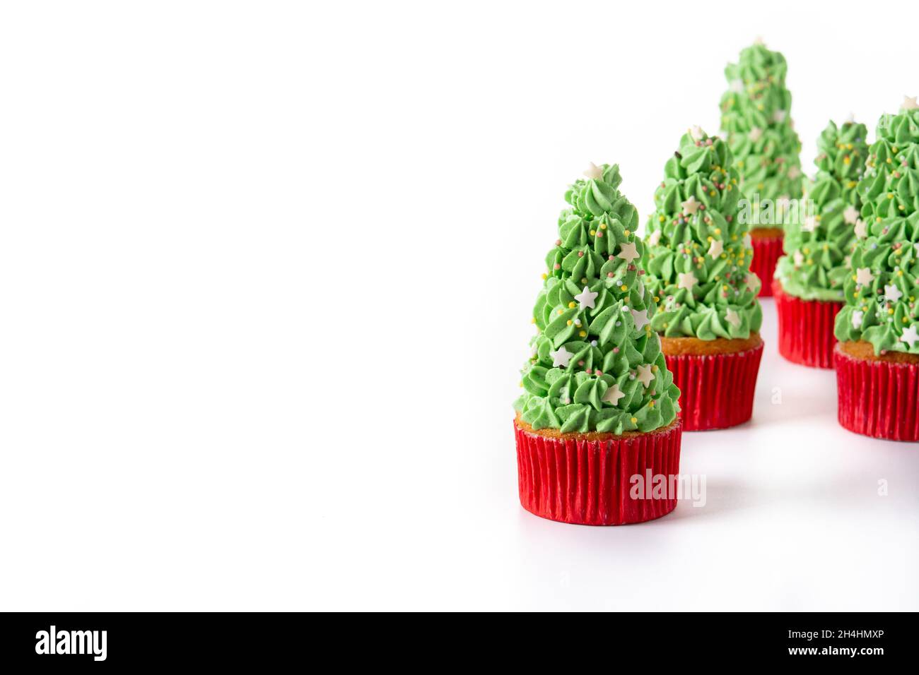 Christmas tree cupcakes isolated on white background Stock Photo