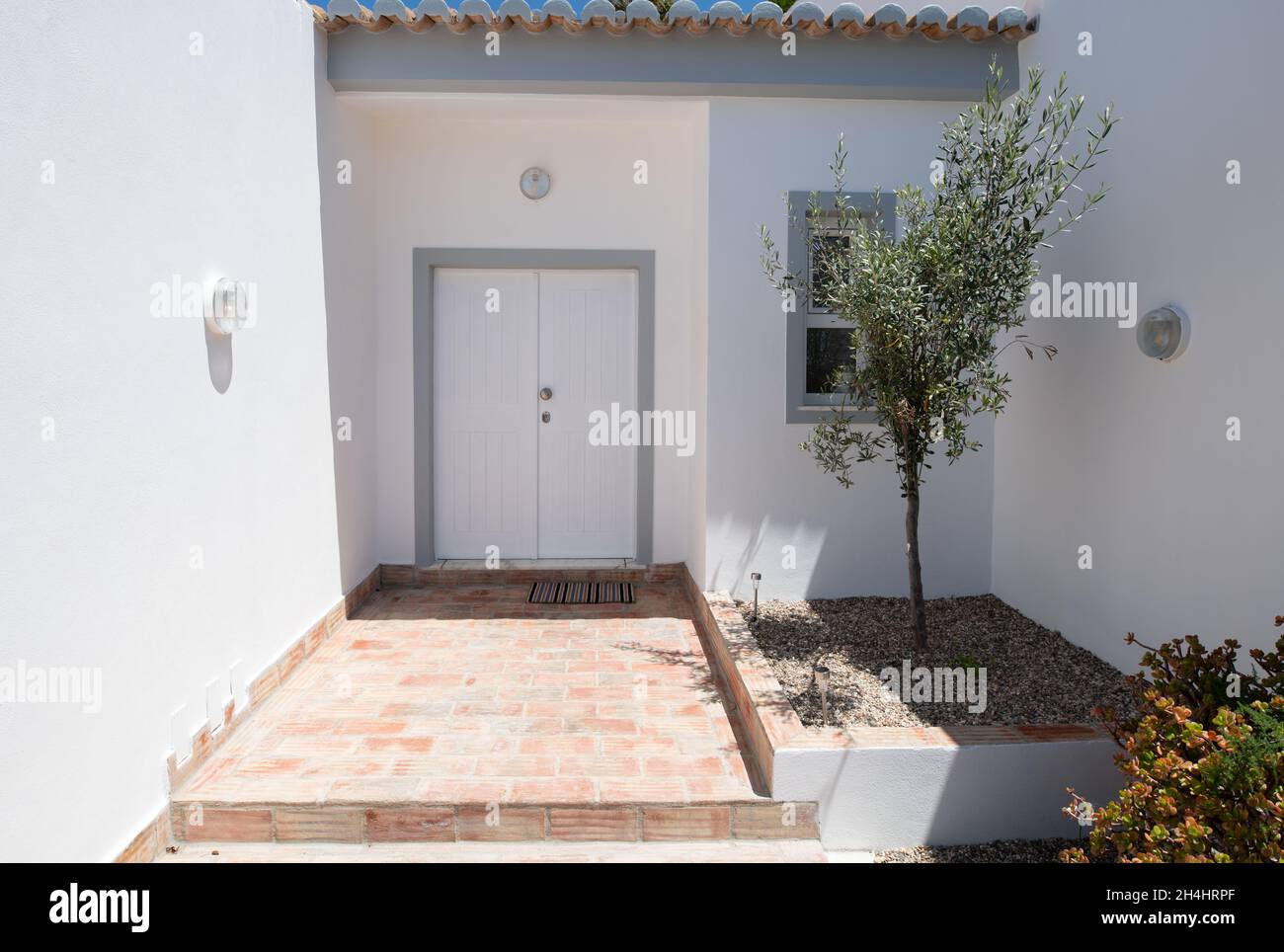 White front door and entrance to portuguese villa Stock Photo