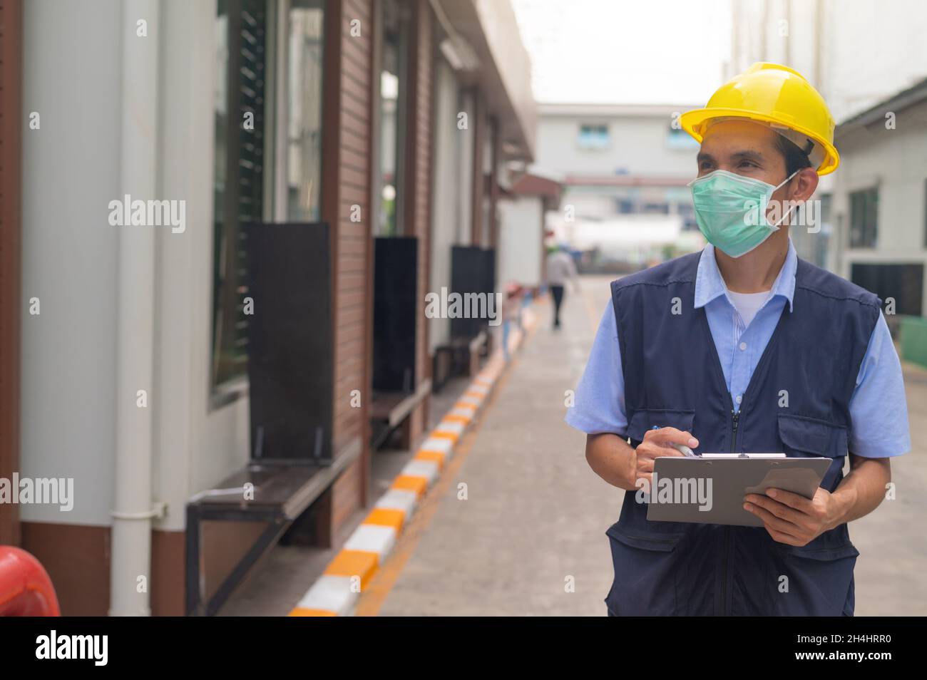 Engineers write industrial factory inspection reports. Stock Photo