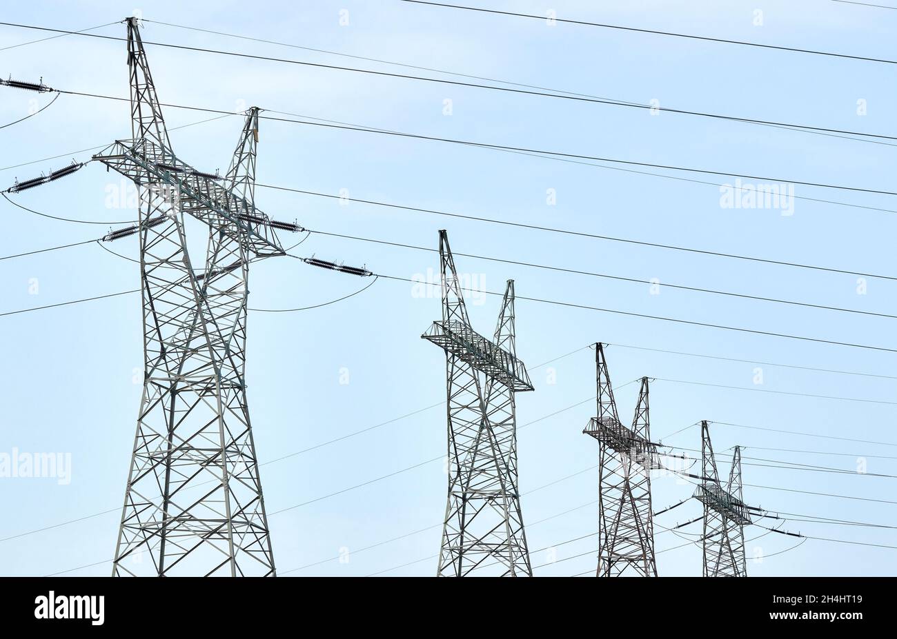 View of high voltage transmission towers. Stock Photo