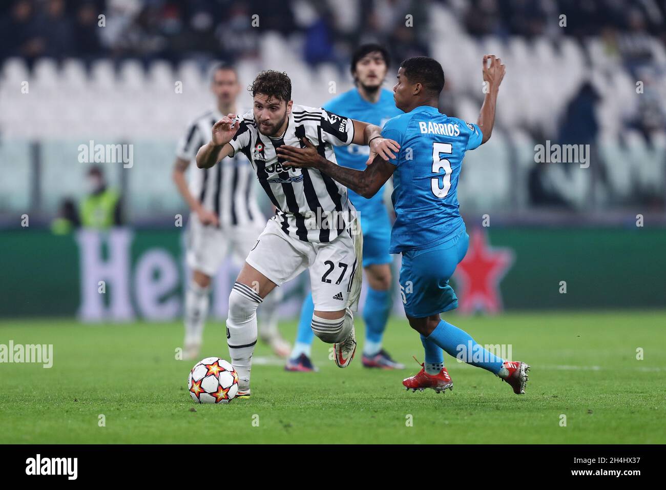 Manuel Locatelli of Juventus Fc  and Wilmar Barrios of Fc Zenit  battle for the ball during the Uefa Champions League Group H  match between Juventus Fc and Zenit St. Petersburg at Allianz Stadium on November 02, 2021 Turin, Italy . Stock Photo