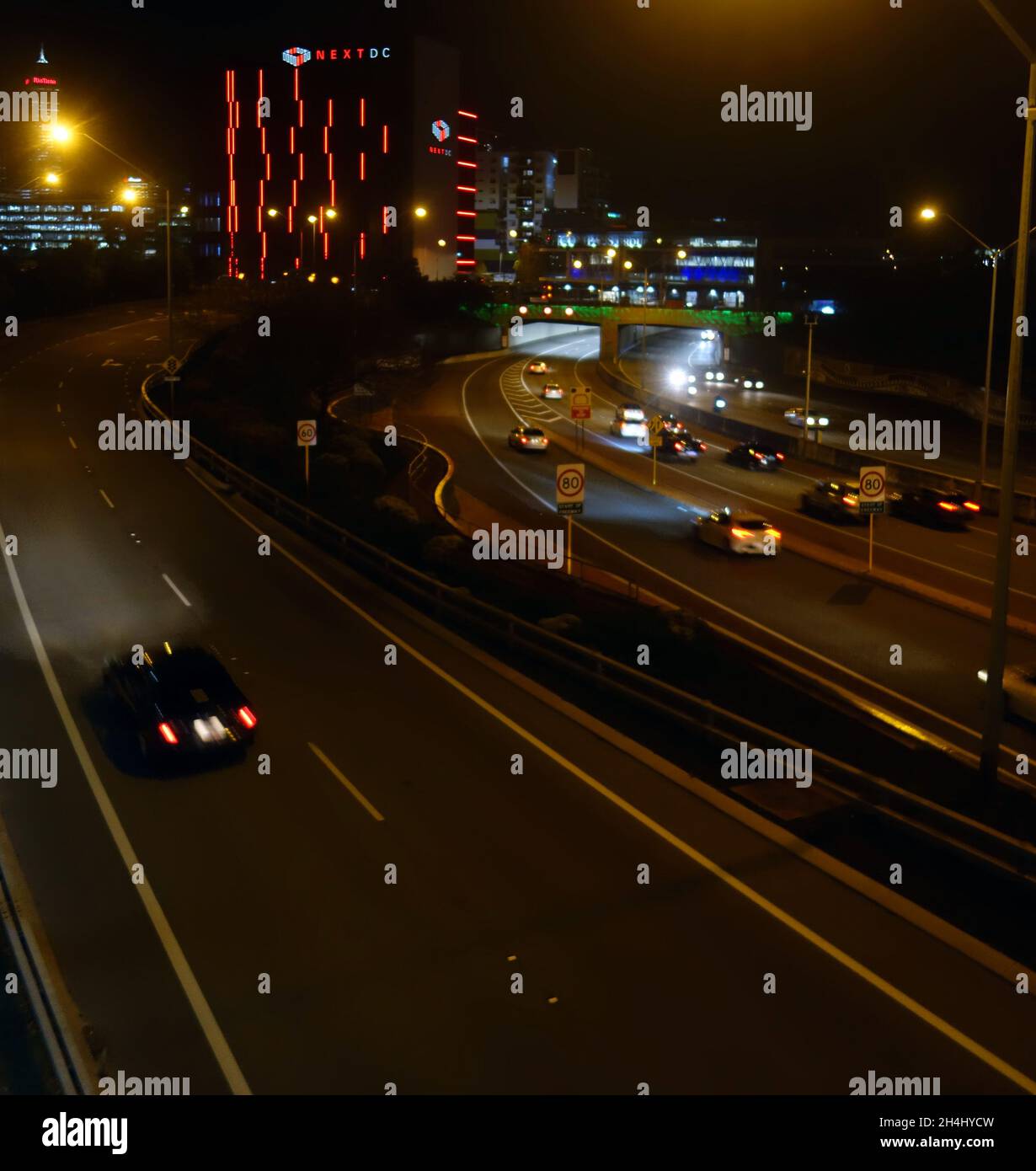 Night view of the NextDC bitcoin mine building built over a highway in Perth  CBD, Western Australia. No PR Stock Photo - Alamy