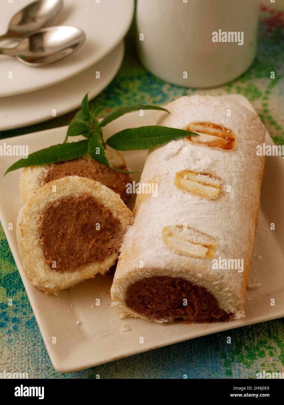 Swiss roll filled with chocolate. Stock Photo