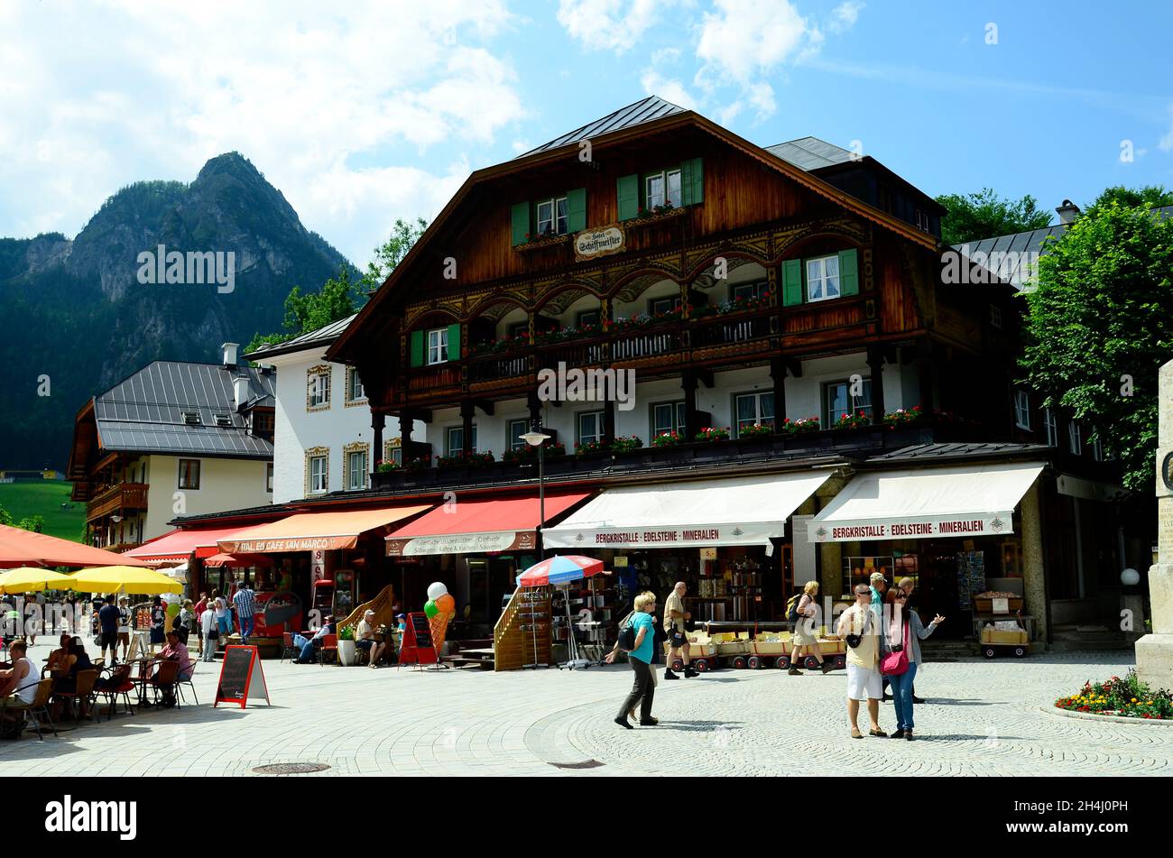 Berchtesgaden, Germany - June 12, 2015: Unidentified tourists, hotel, restaurant and souvenir shops on Koenigssee lake in Bavaria Stock Photo