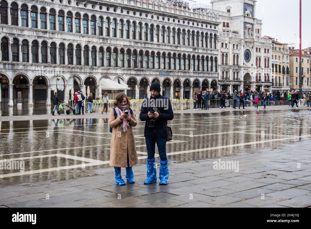 Venice Italy. 03rd November 2021. Tourists walk in a flooded St