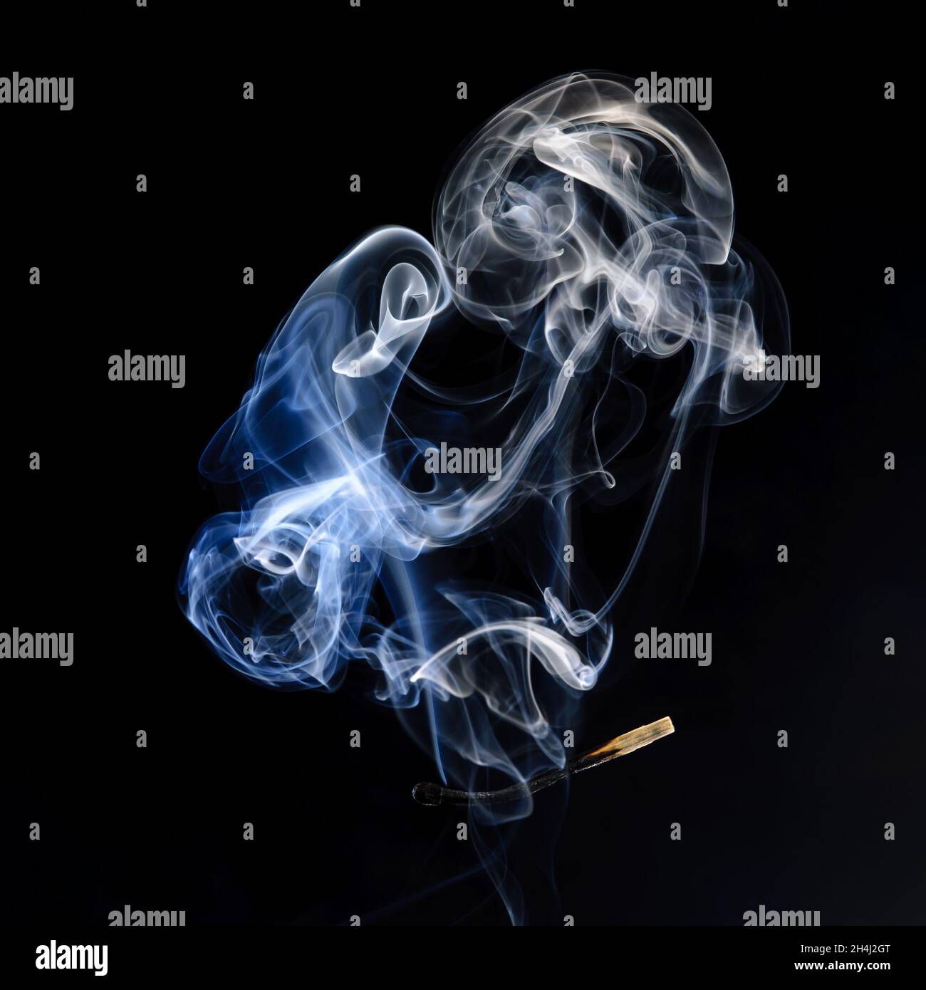 Extinguished and smoking match, Match extinguished and smoking Stock Photo