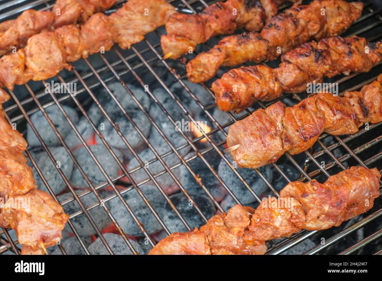 grilled meat on the grill closeup. bbq outdoors. Grill coal Stock