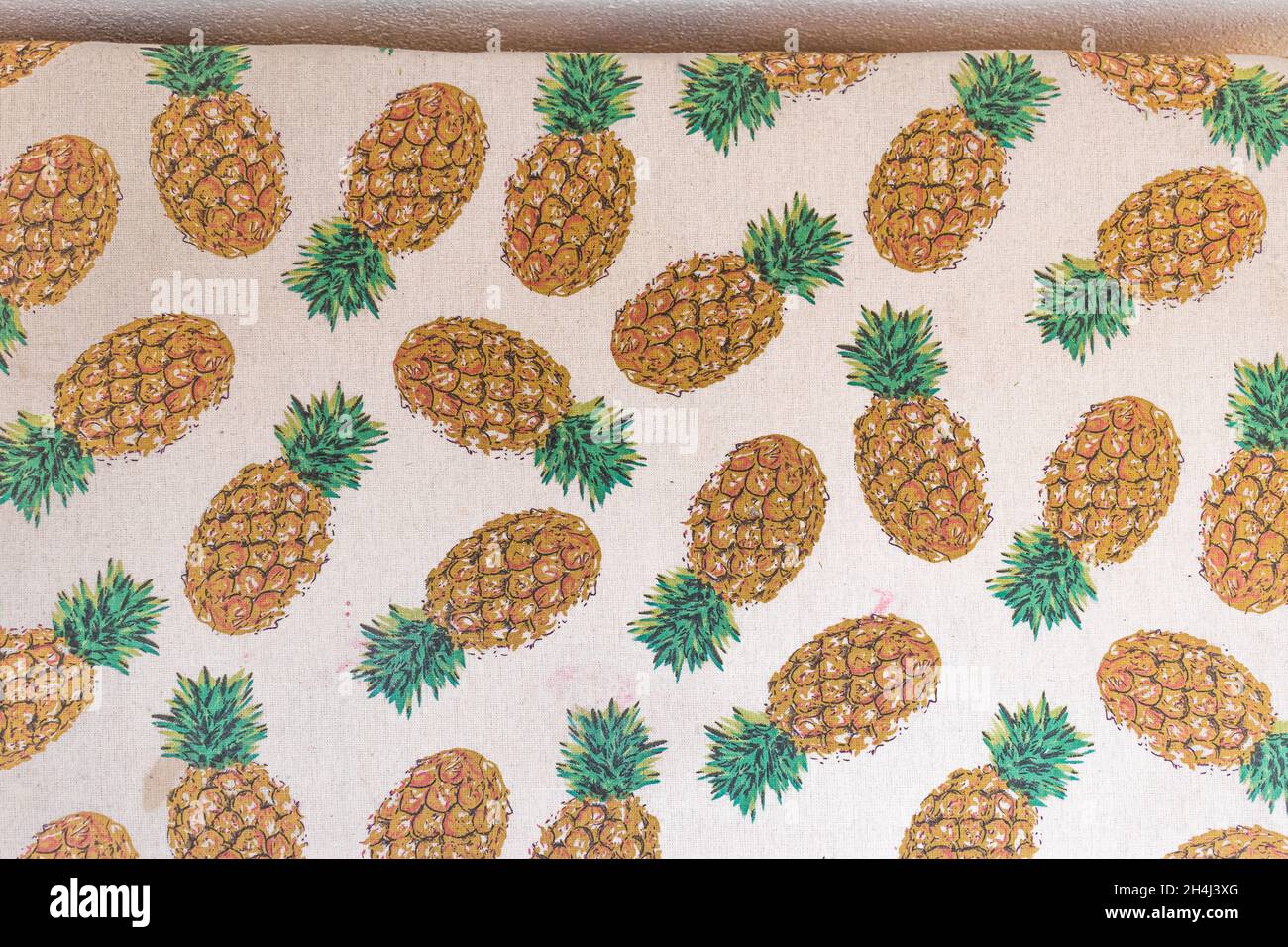 Ananas fruits patterns on a sofa Stock Photo