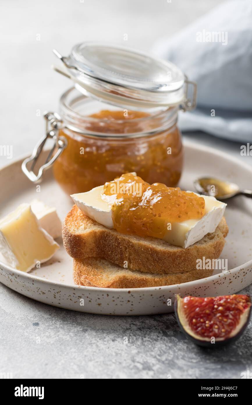 Breakfast toasts with brie cheese and fig jam Stock Photo Alamy