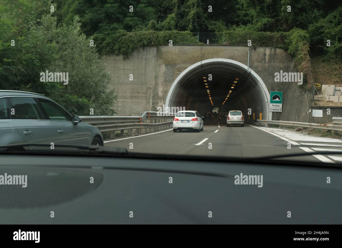 Underground tunnel in the city with cars driving. City infrastructure