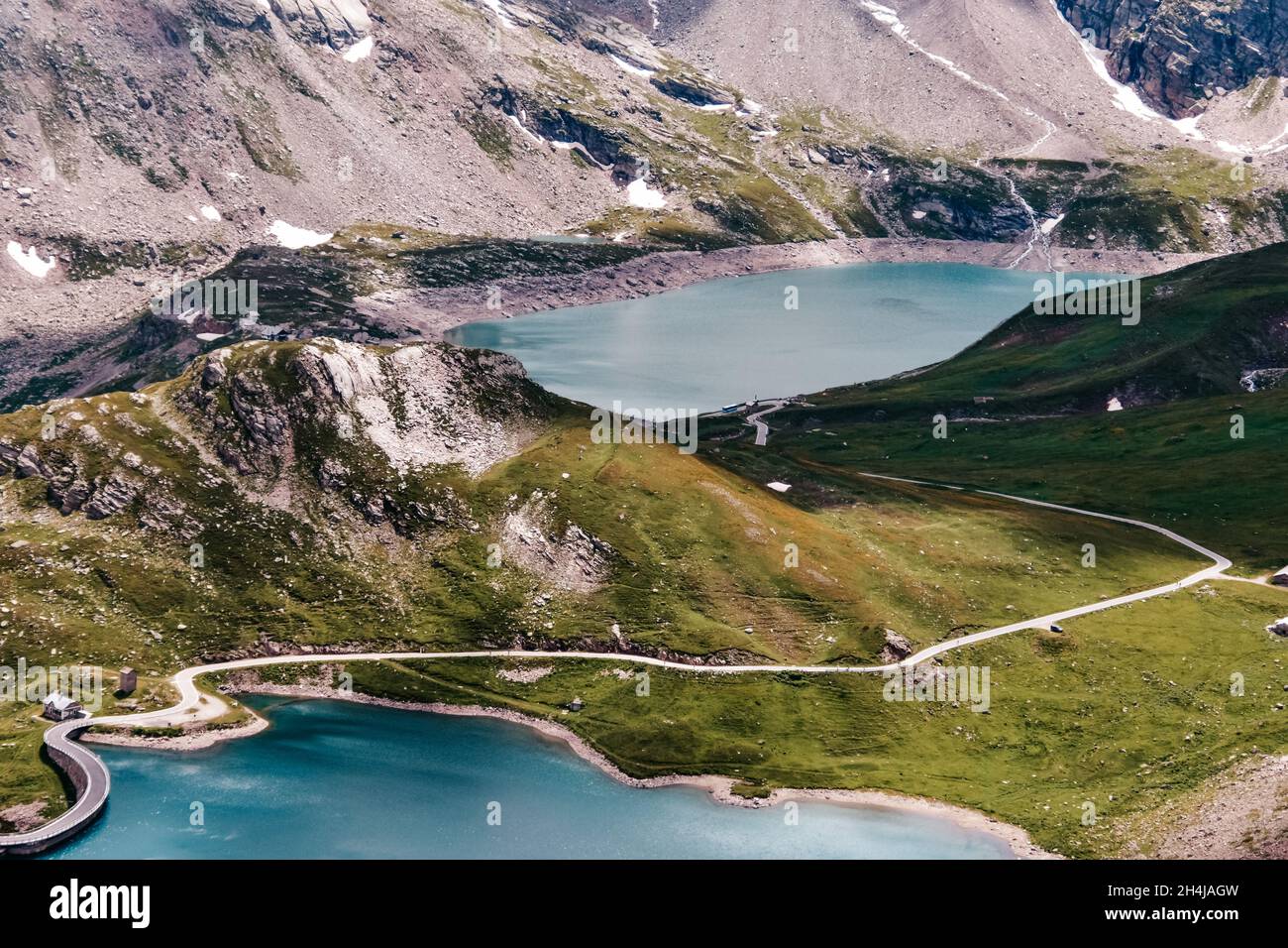 Lago di Ceresole surrounded by hills and greenery in Gran Paradiso Natural Reservation, Italy Stock Photo