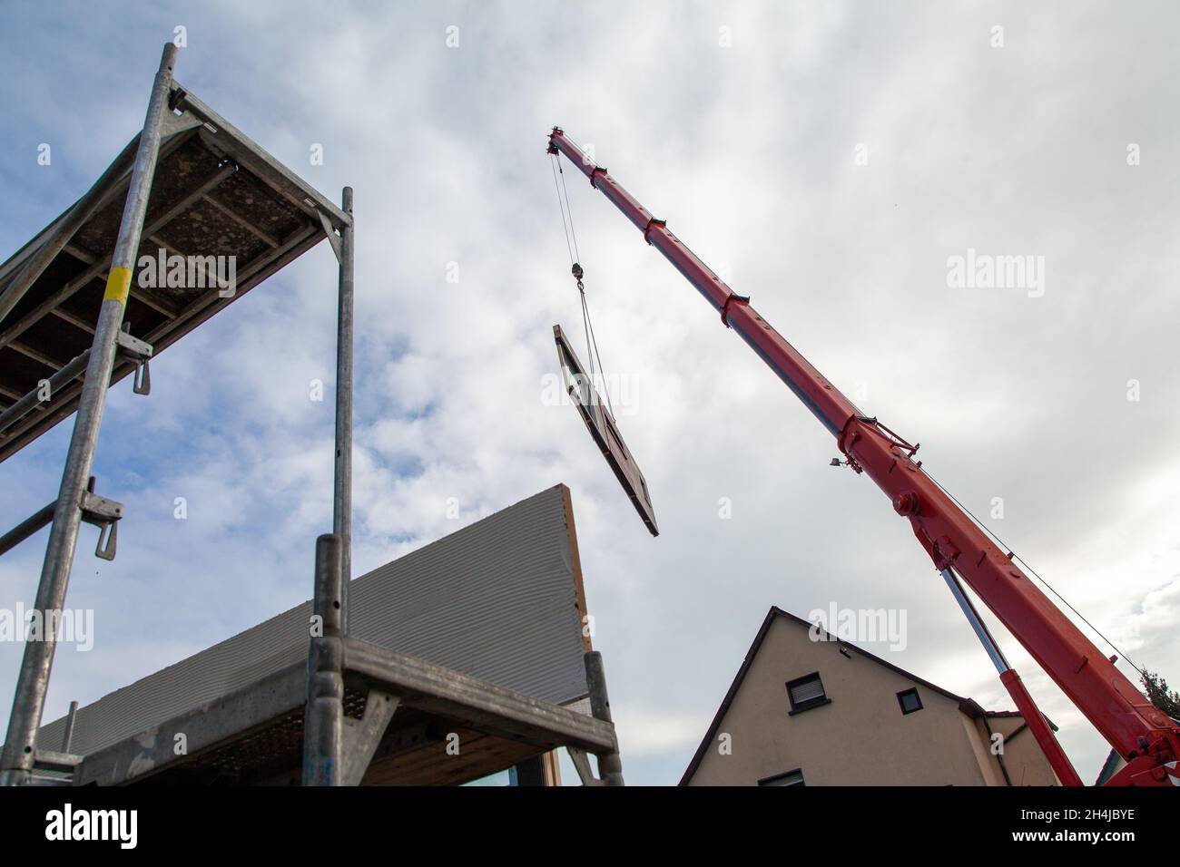 Floating component on a prefabricated house on the boom of a mobile ...