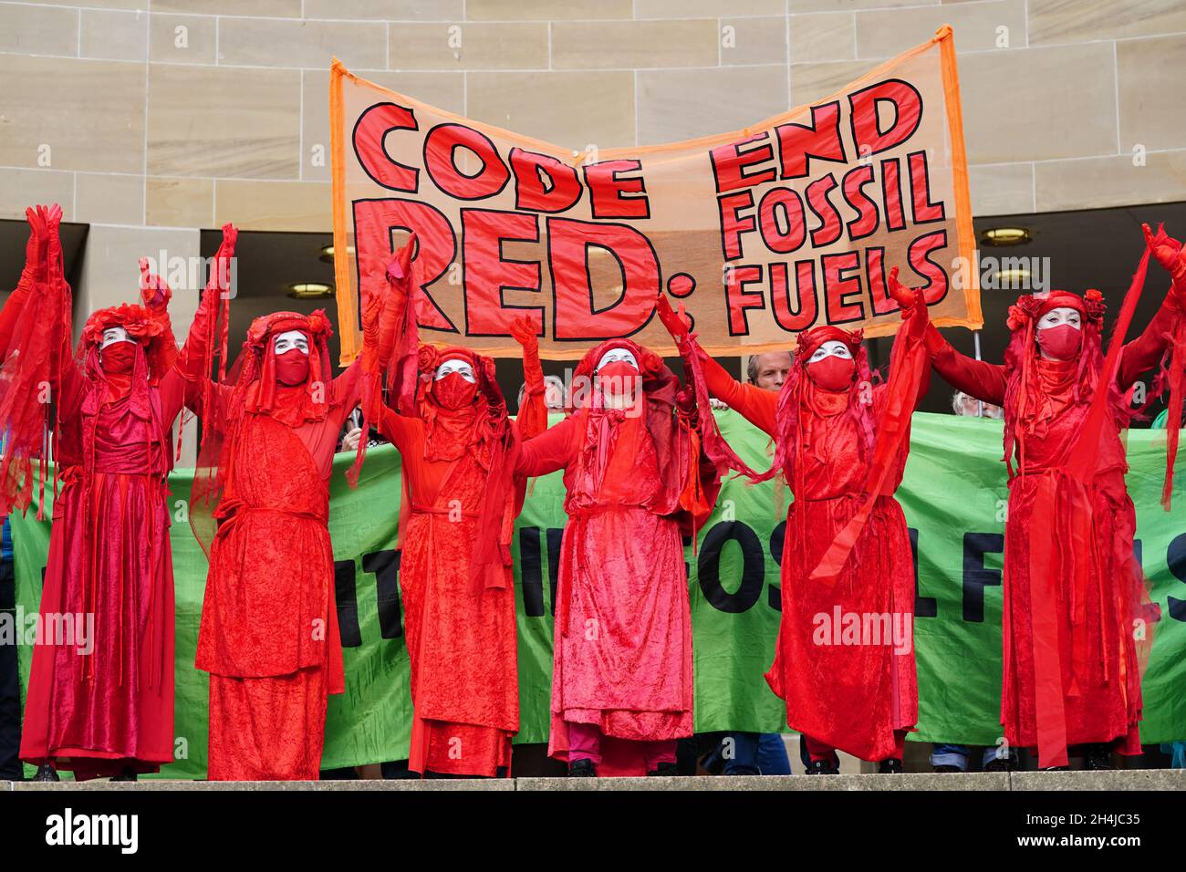 Members of the Red Rebel Brigade take part in a Extinction Rebellion protest on Buchanan Street, during the Cop26 summit in Glasgow. Picture date: Wednesday November 3, 2021. Stock Photo