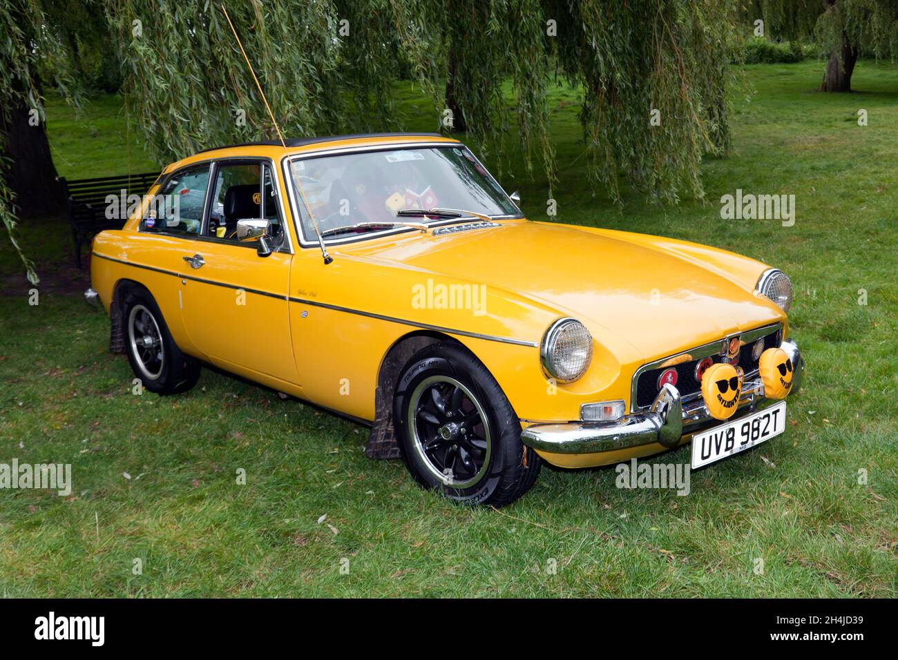 Three-quarter front view of a Yellow, 1979, MGB GT, on display at the Sandwich Festival Classic Car Show 2021 Stock Photo