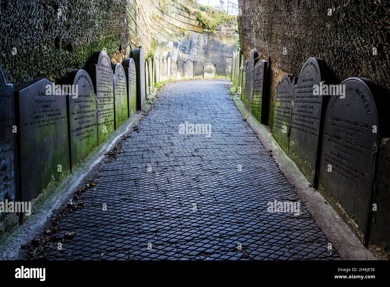 Gravestones at entrance tunnel to  St James’s Cemetery, Liverpool. UK.This fine graveyard in the city centre is best started with a quick walk through Stock Photo