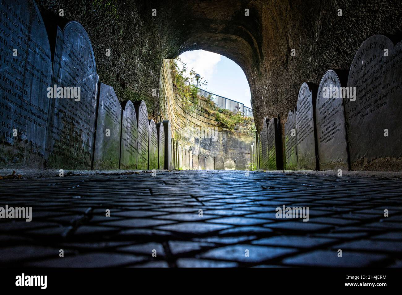 Gravestones at entrance tunnel to  St James’s Cemetery, Liverpool. UK.This fine graveyard in the city centre is best started with a quick walk through Stock Photo